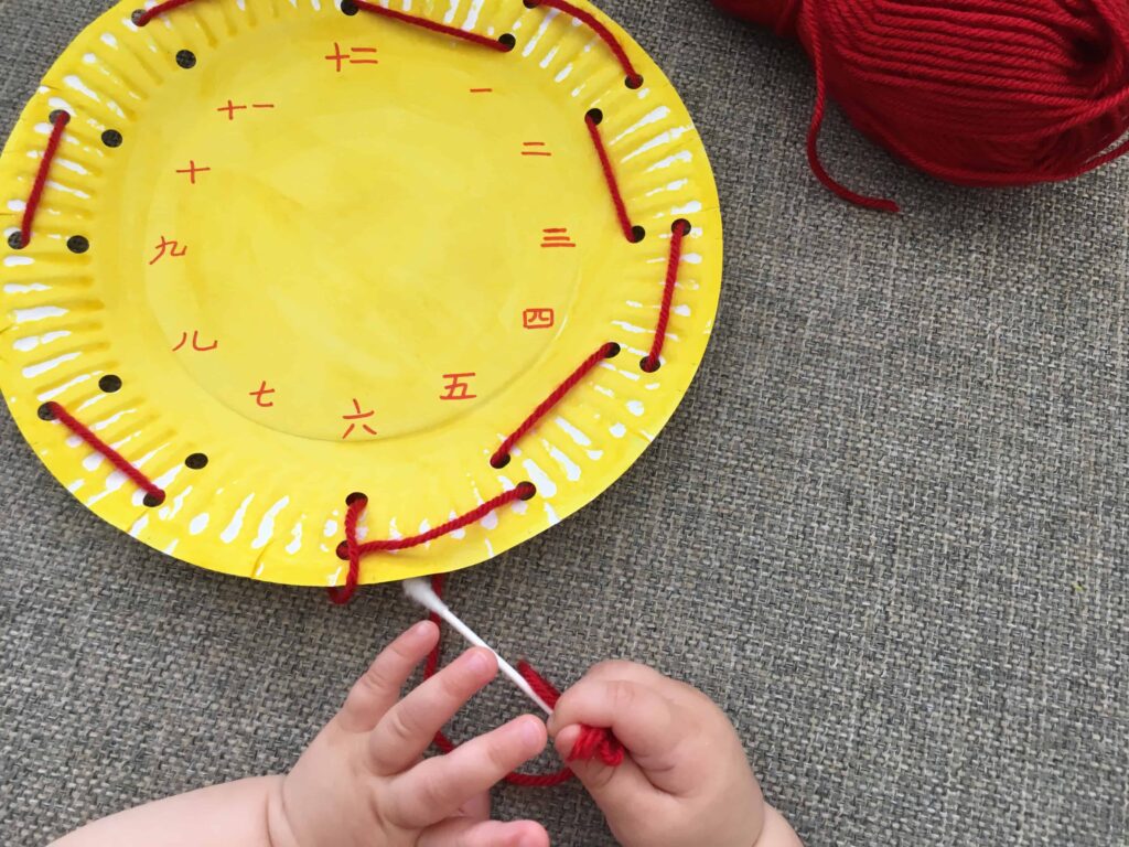 Paper Plate Clock Face Threading - A Fine Motor Numbers Activity for Kids!