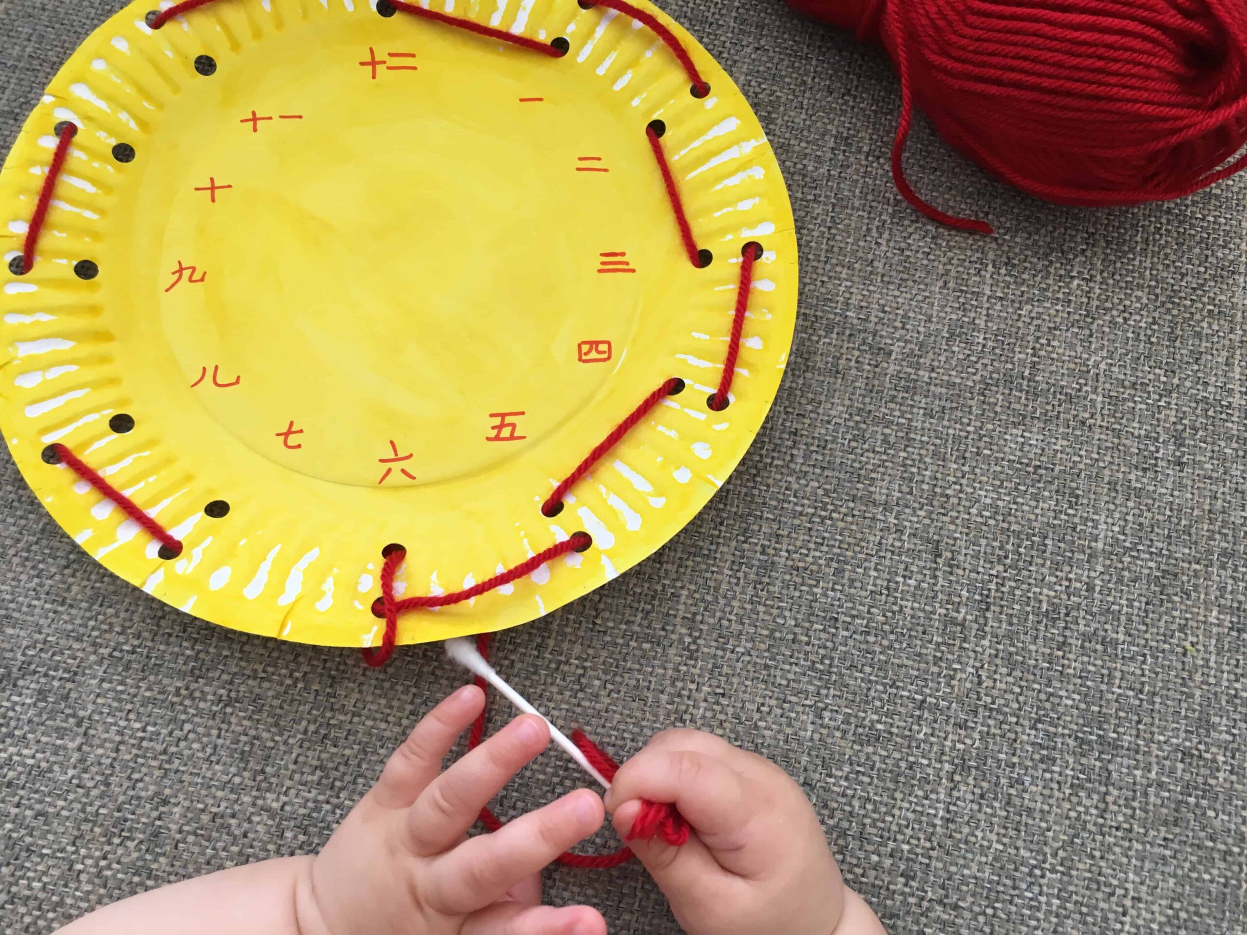 Paper Plate Clock Face Threading – A Fine Motor Numbers Activity for Kids!