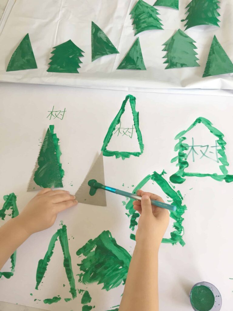 painting cardboard with green paint