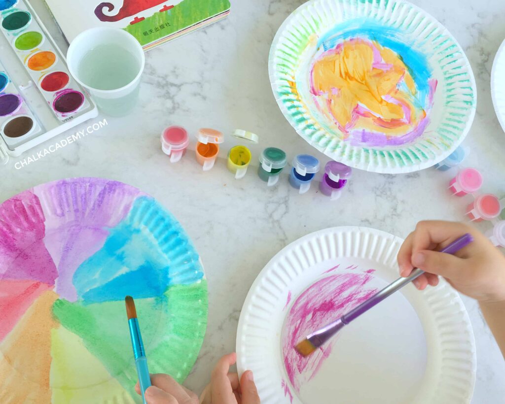 Painting paper plates with color - process art