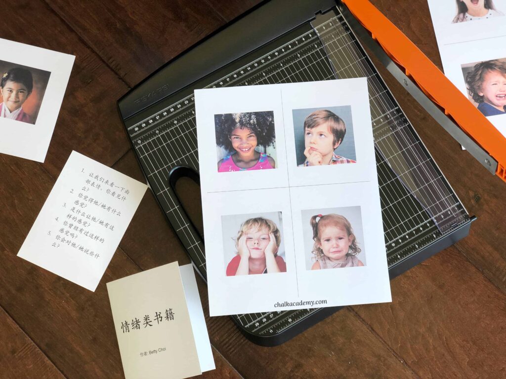cutting Montessori 3-part cards about emotions with real photographs of diverse children