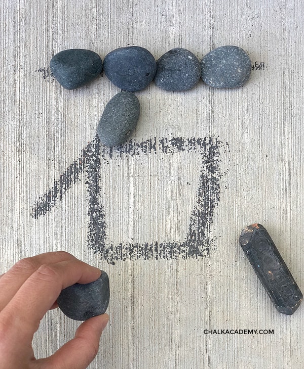 Tracing Chinese character 石 with stones