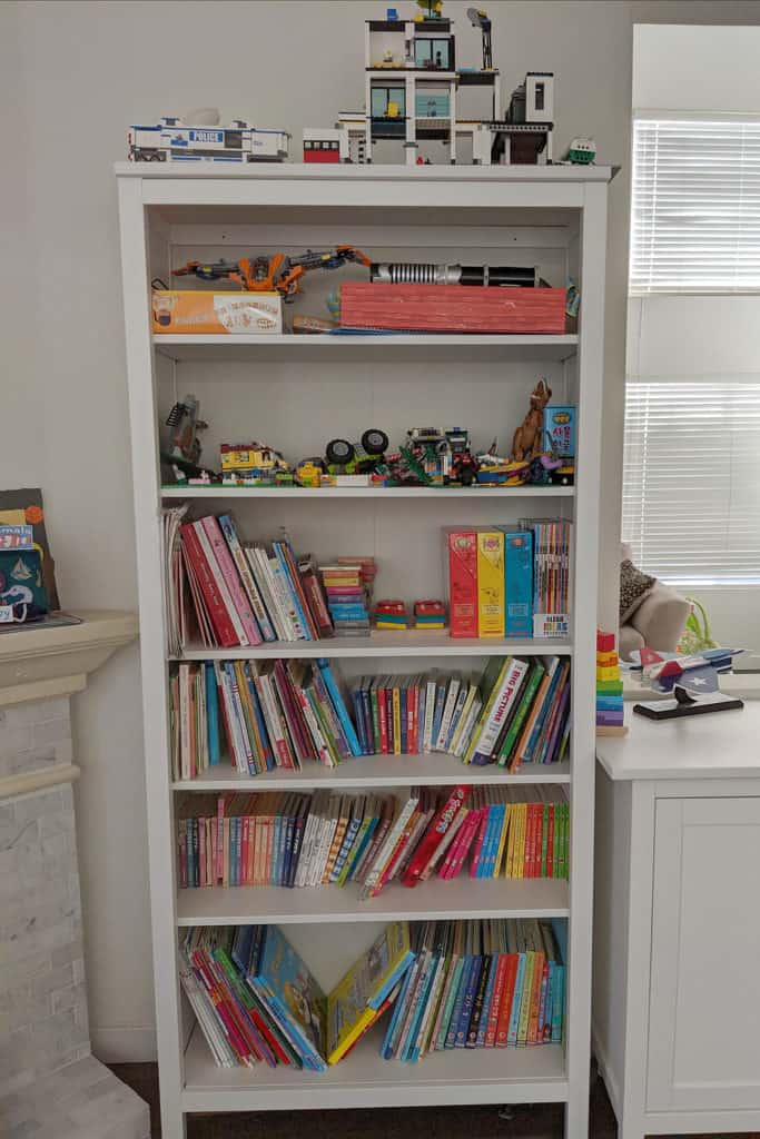 Raising trilingual kids: Bookcase with Korean and English children's books in a trilingual American family's home
