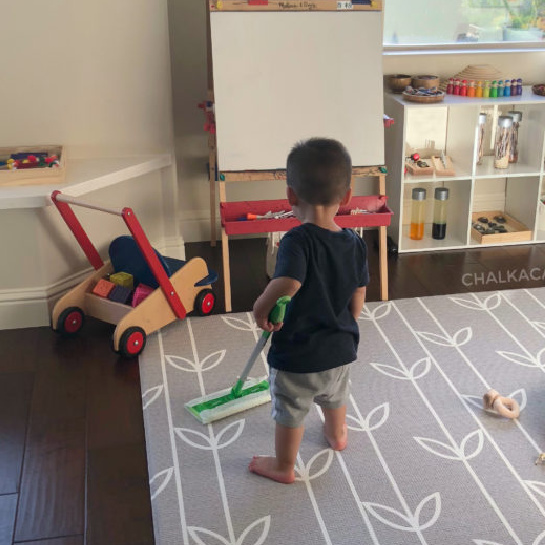 decluttering tips for play room and homework area - organized modern Montessori inspired play room; involve kids in cleaning