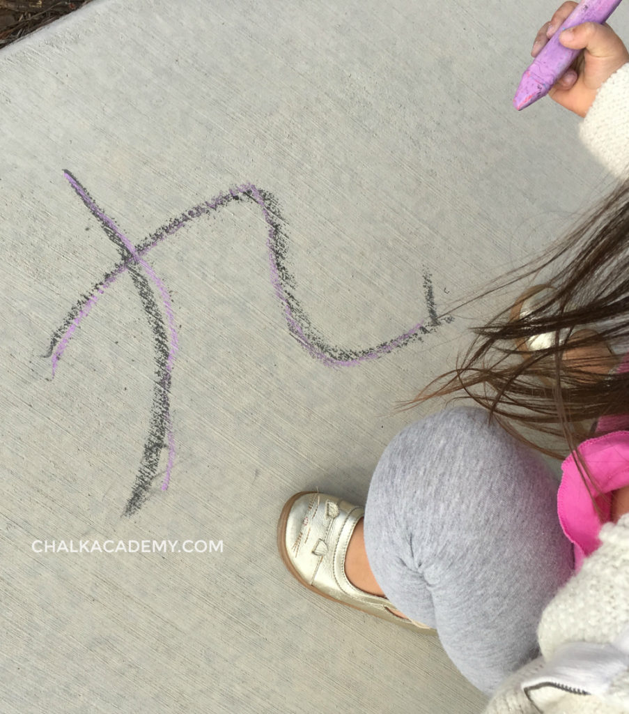 writing Chinese with chalk on pavement