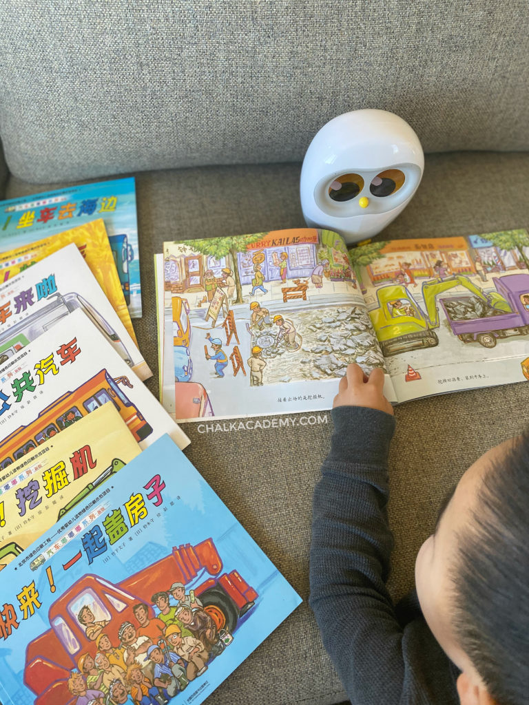 My little boy reading Chinese books about cars, vehicles, and transportation!