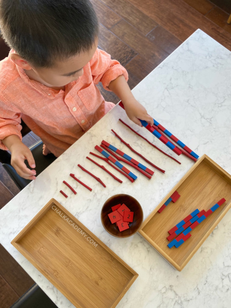Comparing length of DIY red rods (tree branches) and Montessori number rods (blue and red)
