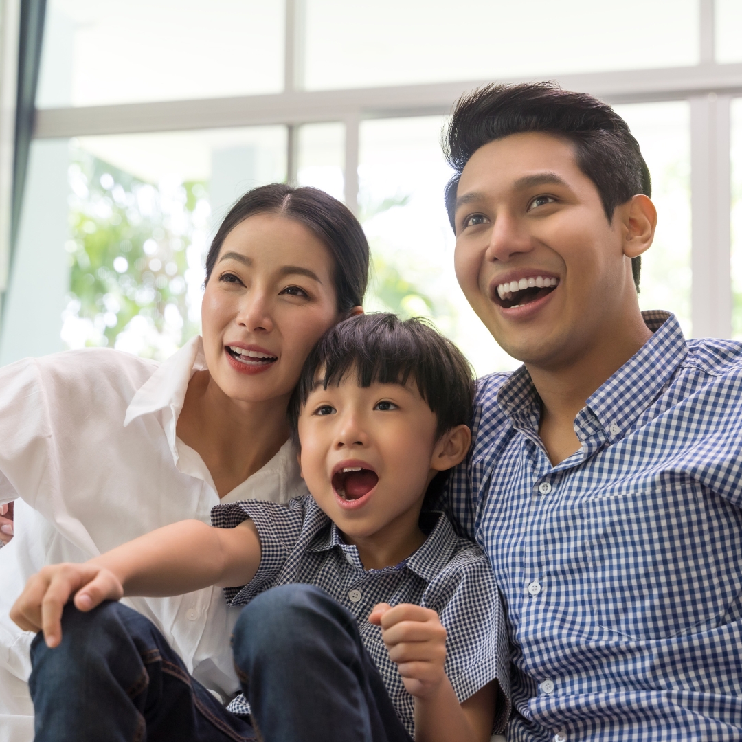 Asian family watching TV shows